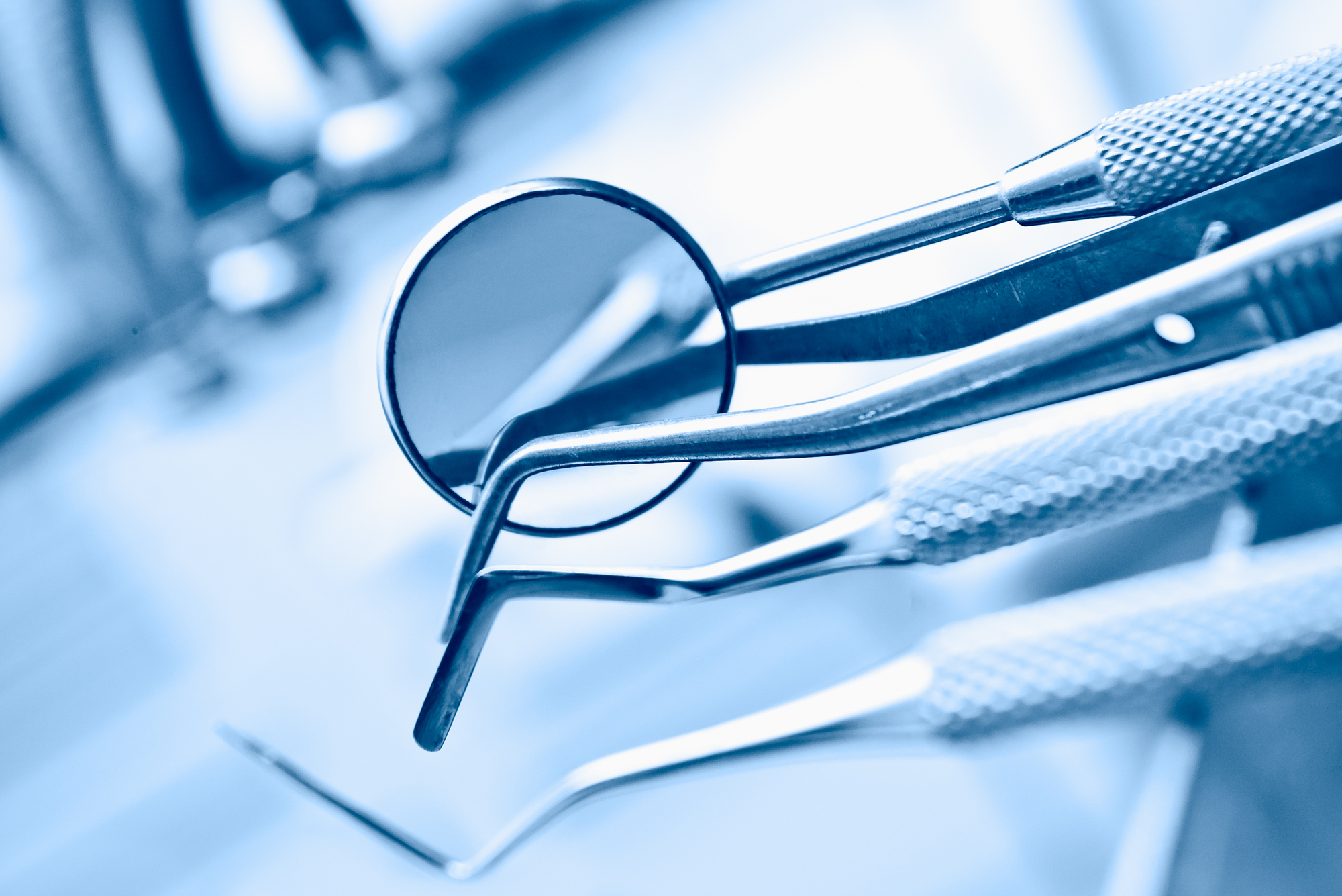 Top Tips For Preparing Your Kid For Braces - dentist's instruments with shallow depth of field blue tinted