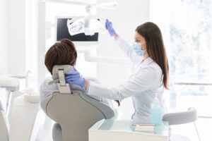 Orthodontics For Older Adults: FAQs - patient in orthodontist chair examination